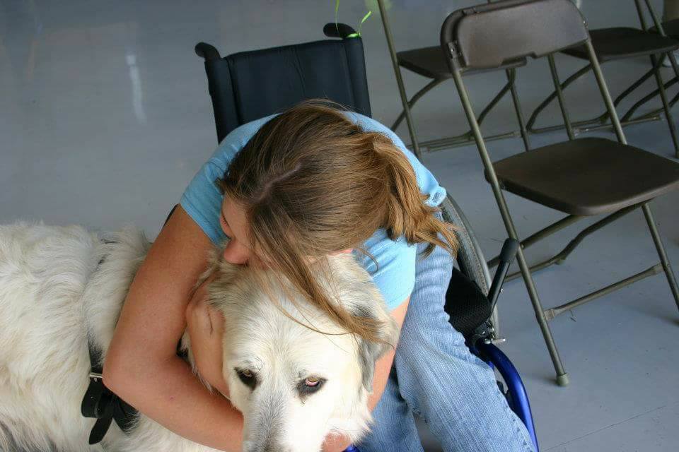 Caitlin and her service dog Badger.